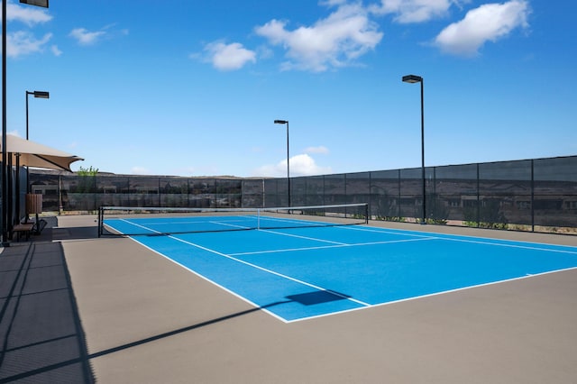 view of sport court featuring community basketball court and fence