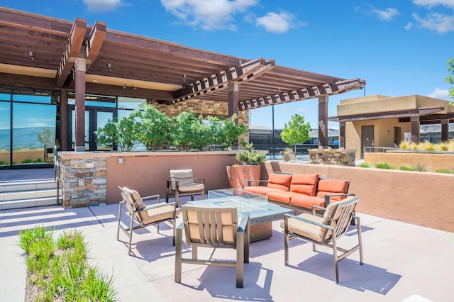 view of patio / terrace featuring an outdoor living space with a fire pit and a pergola
