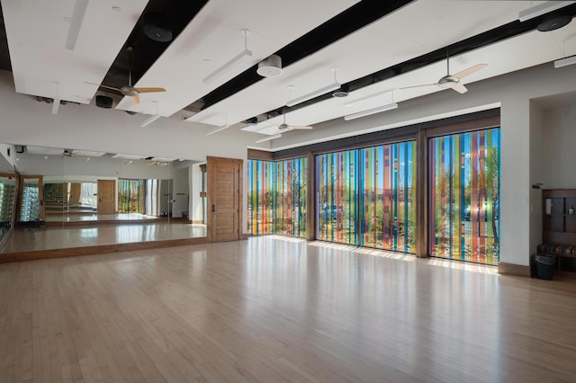 unfurnished room featuring wood finished floors and a ceiling fan