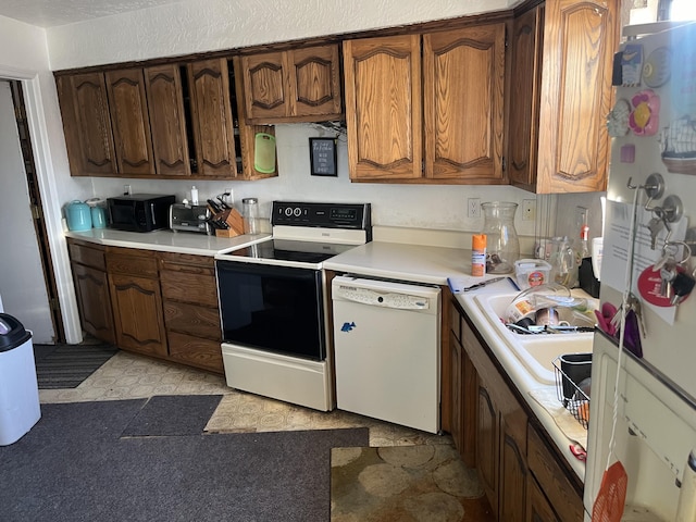 12900 Piru Blvd SE, Albuquerque, NM 87123 - kitchen with a sink, white appliances, and light countertops