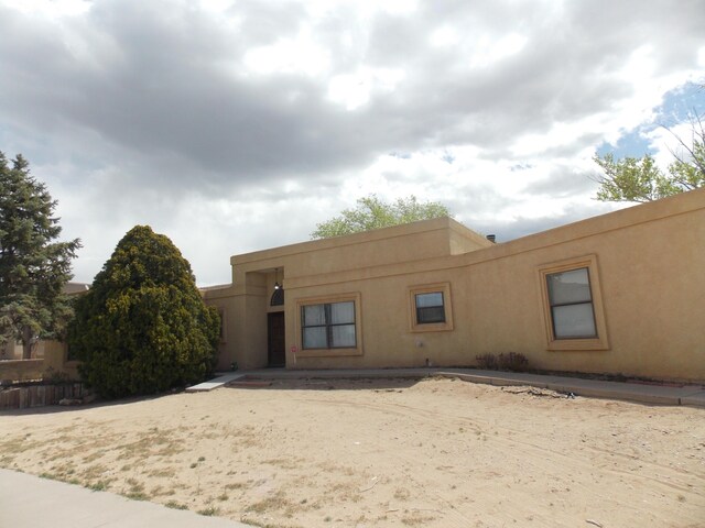 12900 Piru Blvd SE, Albuquerque, NM 87123 - view of front of house with stucco siding