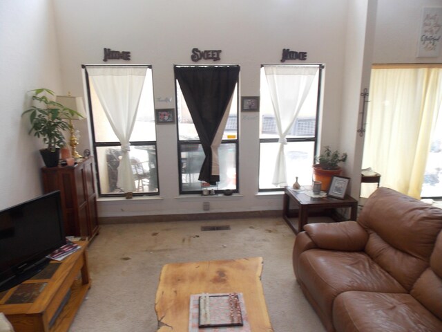 12900 Piru Blvd SE, Albuquerque, NM 87123 - living area featuring light carpet and visible vents