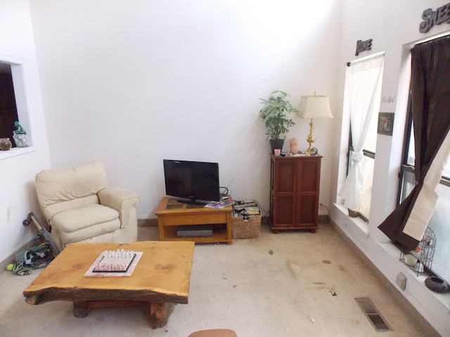 12900 Piru Blvd SE, Albuquerque, NM 87123 - living area featuring carpet flooring and visible vents