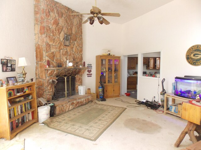 12900 Piru Blvd SE, Albuquerque, NM 87123 - living room with high vaulted ceiling, a fireplace, a ceiling fan, and carpet