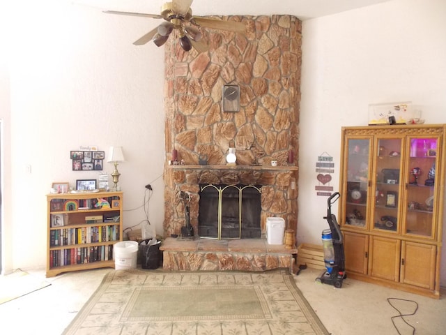 12900 Piru Blvd SE, Albuquerque, NM 87123 - living room with a ceiling fan, a stone fireplace, and carpet flooring