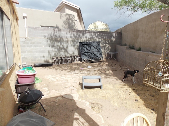 12900 Piru Blvd SE, Albuquerque, NM 87123 - view of patio with a fenced backyard