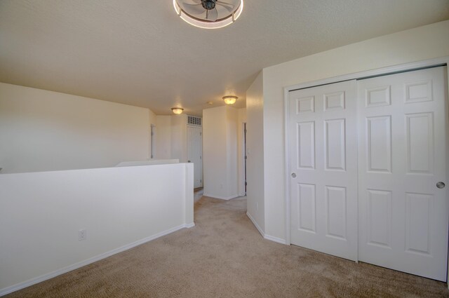 6259 Azaleas Rd NW, Albuquerque, NM 87114 - hall with light colored carpet and baseboards