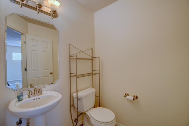 6259 Azaleas Rd NW, Albuquerque, NM 87114 - half bath with a sink and toilet