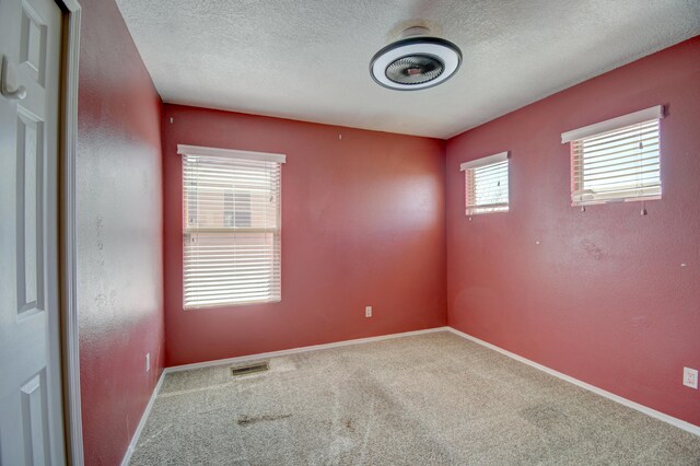 6259 Azaleas Rd NW, Albuquerque, NM 87114 - carpeted spare room with a textured ceiling
