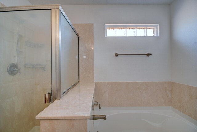 6259 Azaleas Rd NW, Albuquerque, NM 87114 - bathroom featuring a bath and a stall shower