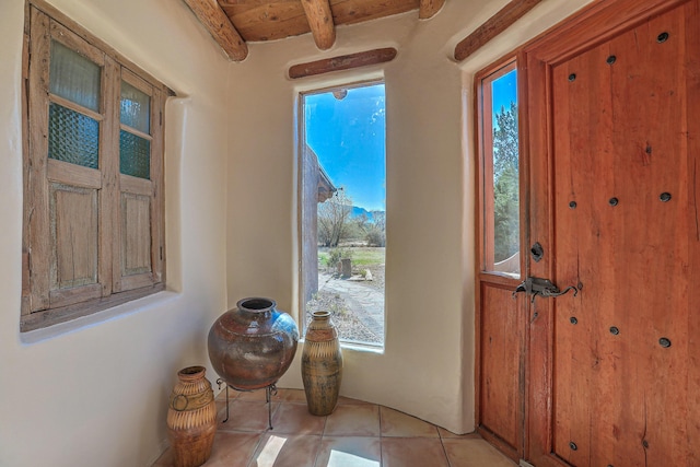 78 Quirks Ln, Corrales, NM 87048 - entryway featuring beam ceiling and light tile patterned floors