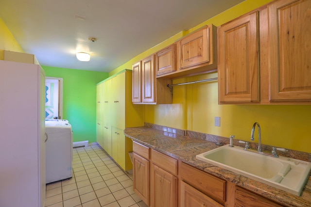 78 Quirks Ln, Corrales, NM 87048 - kitchen with a sink, washer / dryer, and light tile patterned floors