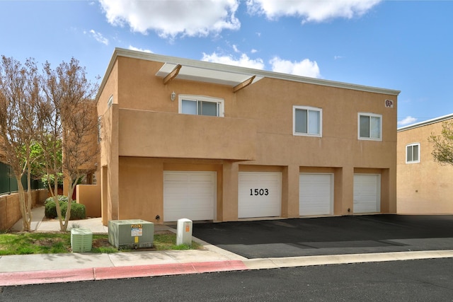 4701 Morris St NE Unit 1503, Albuquerque, NM 87111 - exterior space with a garage, driveway, and stucco siding