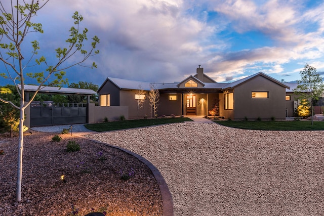 1016 Guadalupe Villa NW, Albuquerque, NM 87114 - view of front of property featuring a chimney, a front lawn, fence, and stucco siding