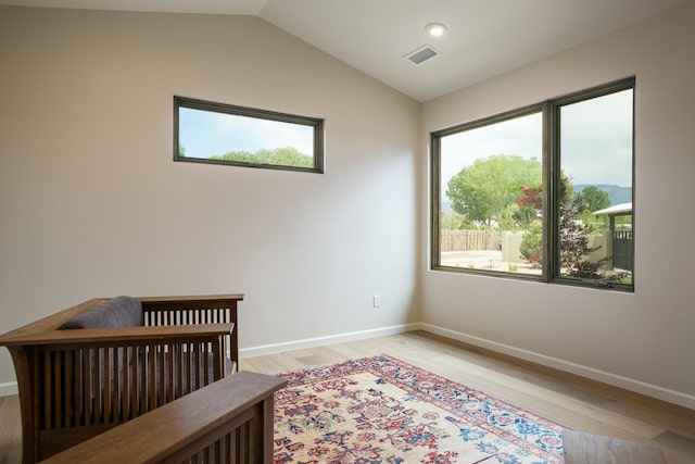1016 Guadalupe Villa NW, Albuquerque, NM 87114 - bedroom with light wood-type flooring, visible vents, multiple windows, and vaulted ceiling