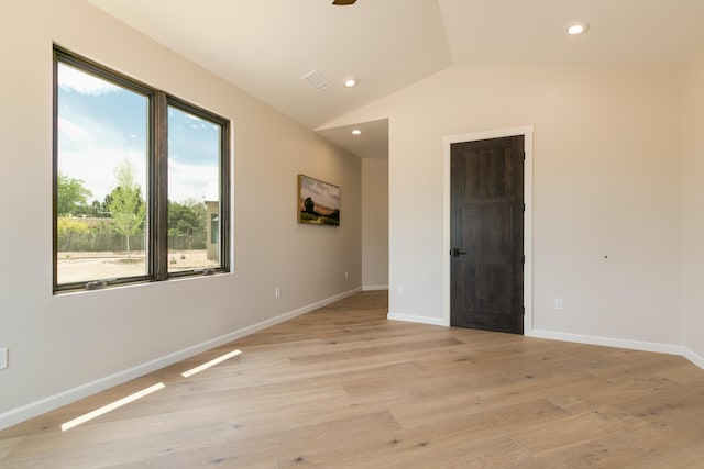 1016 Guadalupe Villa NW, Albuquerque, NM 87114 - spare room with baseboards, recessed lighting, light wood-type flooring, and vaulted ceiling