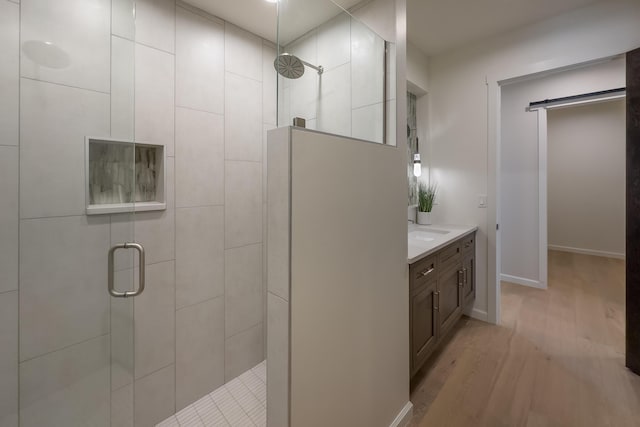 1016 Guadalupe Villa NW, Albuquerque, NM 87114 - full bath featuring a shower stall, vanity, baseboards, and wood finished floors