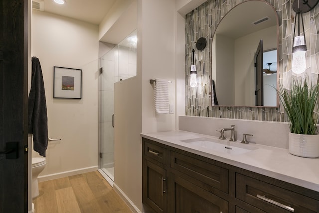 1016 Guadalupe Villa NW, Albuquerque, NM 87114 - full bath featuring a stall shower, wood finished floors, vanity, and visible vents