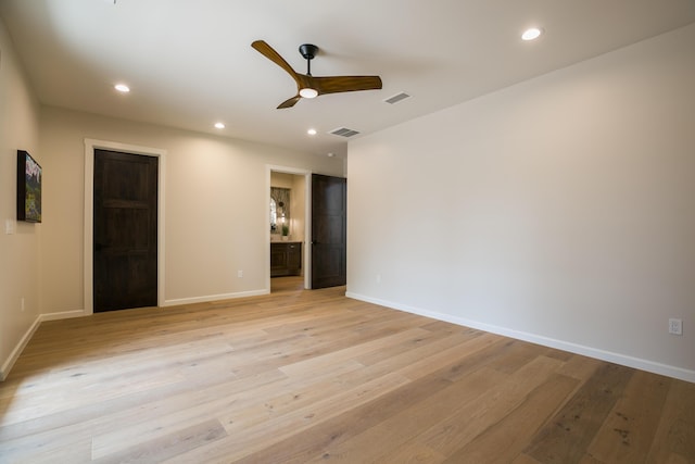 1016 Guadalupe Villa NW, Albuquerque, NM 87114 - spare room featuring visible vents, baseboards, a ceiling fan, and light wood-style floors