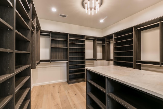 1016 Guadalupe Villa NW, Albuquerque, NM 87114 - spacious closet with light wood finished floors and visible vents