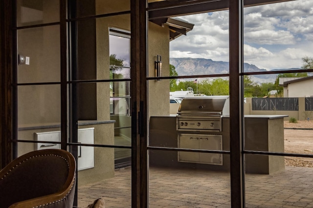 1016 Guadalupe Villa NW, Albuquerque, NM 87114 - doorway with brick floor and a mountain view