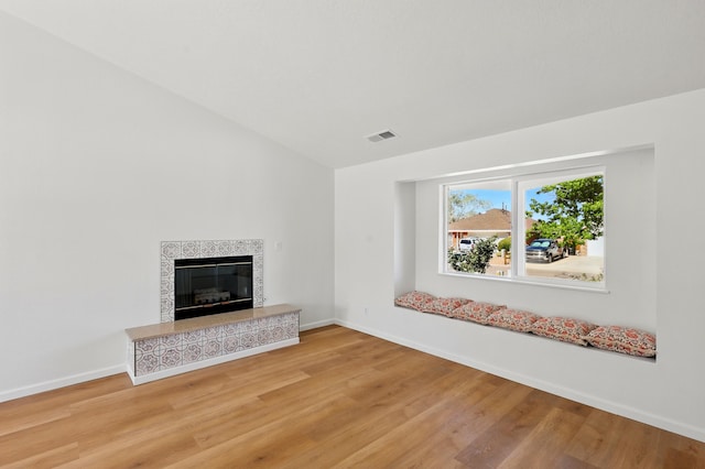 16 Apache Plume Rd, Los Lunas, NM 87031 - unfurnished living room with light wood-style flooring and a fireplace