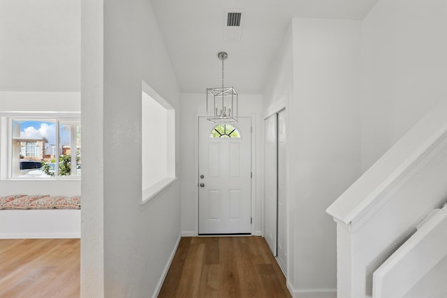 16 Apache Plume Rd, Los Lunas, NM 87031 - doorway to outside with wood finished floors and lofted ceiling