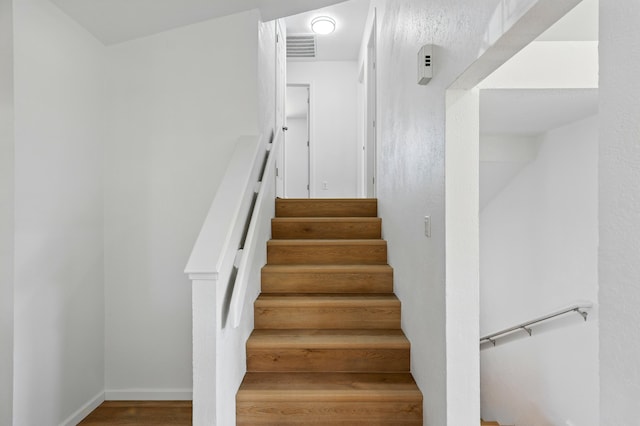 16 Apache Plume Rd, Los Lunas, NM 87031 - stairway featuring wood finished floors and baseboards