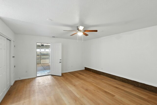 16 Apache Plume Rd, Los Lunas, NM 87031 - unfurnished bedroom with light wood-style flooring and ceiling fan