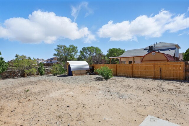 16 Apache Plume Rd, Los Lunas, NM 87031 - fenced yard featuring a shed