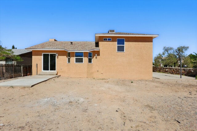 16 Apache Plume Rd, Los Lunas, NM 87031 - rear view of property featuring stucco siding and a patio
