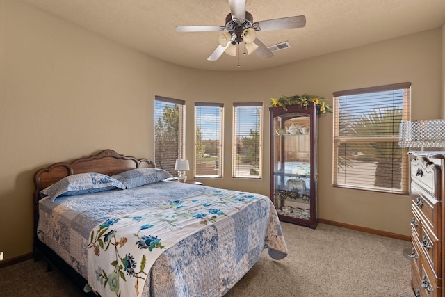 3605 Greystone Ridge Dr SE, Rio Rancho, NM 87124 - carpeted bedroom featuring multiple windows, baseboards, and a ceiling fan