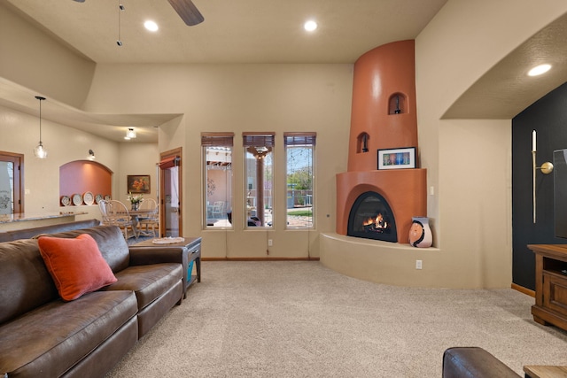 3605 Greystone Ridge Dr SE, Rio Rancho, NM 87124 - living room featuring carpet, a fireplace, a ceiling fan, recessed lighting, and baseboards