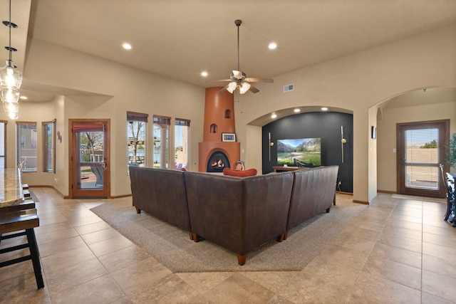 3605 Greystone Ridge Dr SE, Rio Rancho, NM 87124 - living room with recessed lighting, arched walkways, a ceiling fan, light tile patterned floors, and baseboards