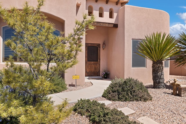 3605 Greystone Ridge Dr SE, Rio Rancho, NM 87124 - doorway to property featuring stucco siding