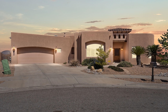 3605 Greystone Ridge Dr SE, Rio Rancho, NM 87124 - view of front of property with stucco siding, concrete driveway, an attached garage, and a tiled roof