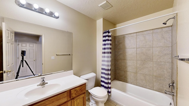 504 Maple Ave, Moriarty, NM 87035 - bathroom with shower / tub combo with curtain, toilet, a textured ceiling, vanity, and tile patterned flooring