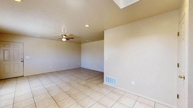 504 Maple Ave, Moriarty, NM 87035 - unfurnished room featuring a ceiling fan, recessed lighting, and light tile patterned flooring