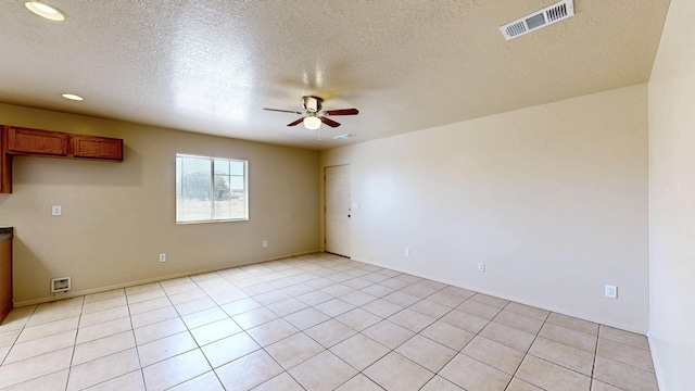 504 Maple Ave, Moriarty, NM 87035 - unfurnished room with a ceiling fan, recessed lighting, a textured ceiling, baseboards, and light tile patterned floors