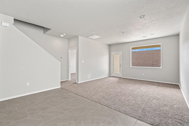 6814 Atherstone Ln NW, Albuquerque, NM 87114 - carpeted spare room with a textured ceiling, baseboards, and recessed lighting