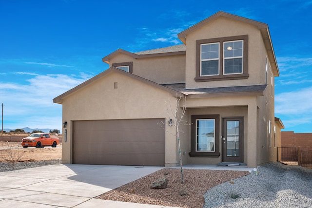 6814 Atherstone Ln NW, Albuquerque, NM 87114 - view of front of home with stucco siding, driveway, a garage, and roof with shingles