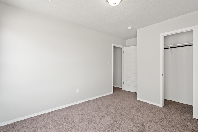 6814 Atherstone Ln NW, Albuquerque, NM 87114 - unfurnished bedroom with carpet floors, a closet, a textured ceiling, and baseboards