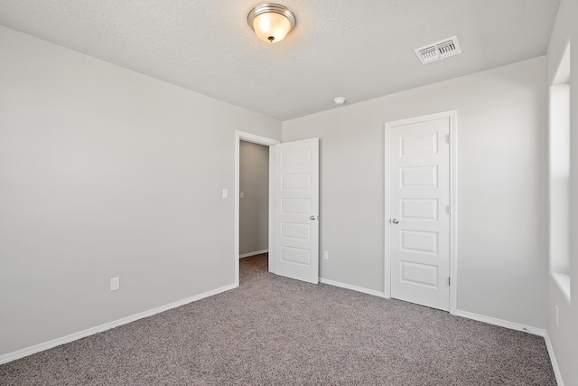 6814 Atherstone Ln NW, Albuquerque, NM 87114 - unfurnished bedroom with carpet and a textured ceiling