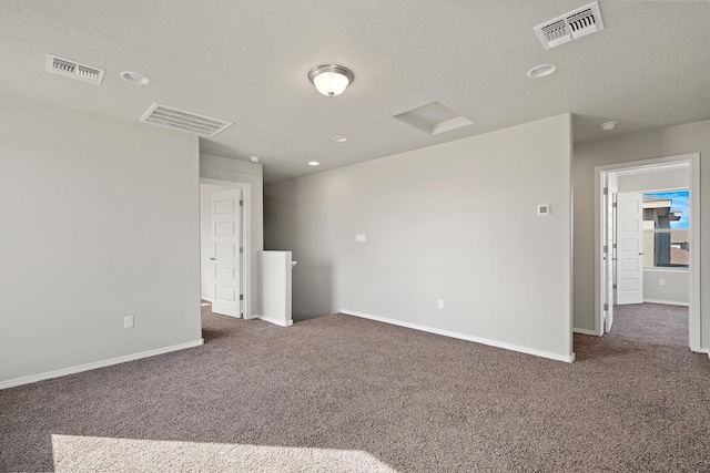 6814 Atherstone Ln NW, Albuquerque, NM 87114 - carpeted spare room featuring baseboards, a textured ceiling, and recessed lighting