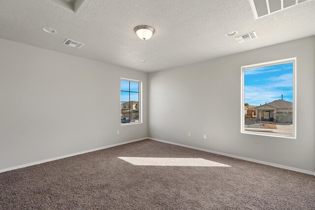 6814 Atherstone Ln NW, Albuquerque, NM 87114 - unfurnished room with carpet floors, a textured ceiling, and baseboards