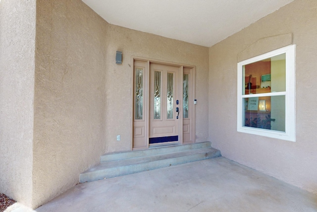 122 Martha Ct, Corrales, NM 87048 - doorway to property featuring stucco siding