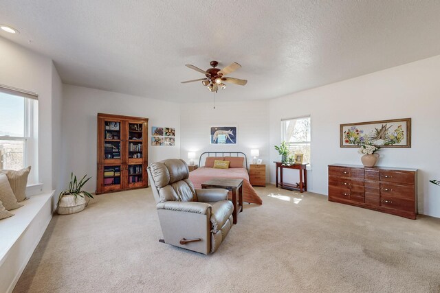 122 Martha Ct, Corrales, NM 87048 - bedroom with a textured ceiling, a ceiling fan, and carpet floors