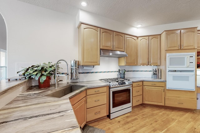 122 Martha Ct, Corrales, NM 87048 - kitchen with white appliances, light brown cabinets, and under cabinet range hood