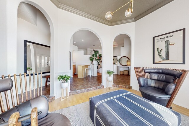 122 Martha Ct, Corrales, NM 87048 - interior space featuring arched walkways, wood finished floors, and ornamental molding