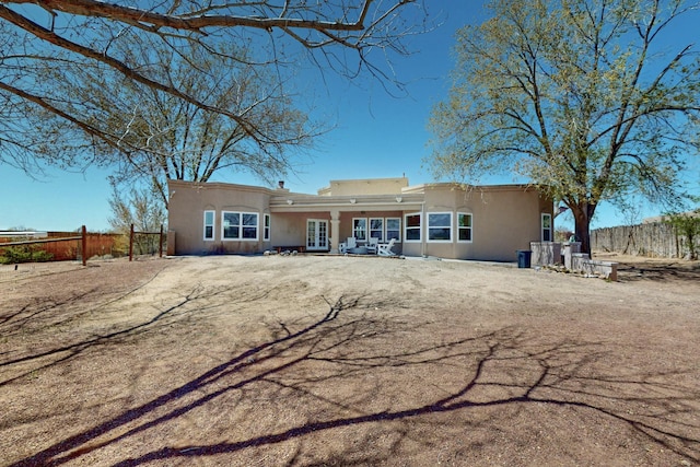 122 Martha Ct, Corrales, NM 87048 - back of house with fence and stucco siding